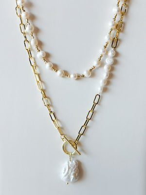 Gold paperclip with pearl charm